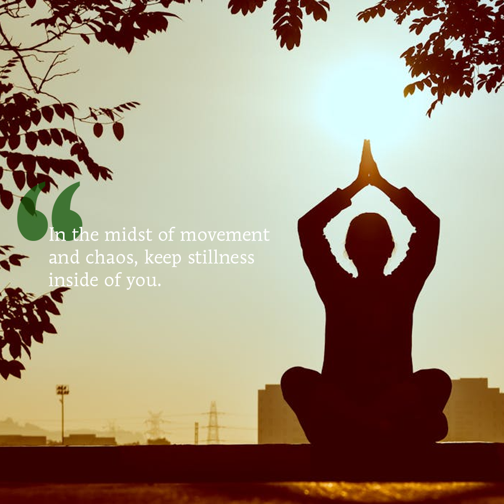 Silhouette of a person meditating with a cityscape and trees in the background, featuring a motivational quote.