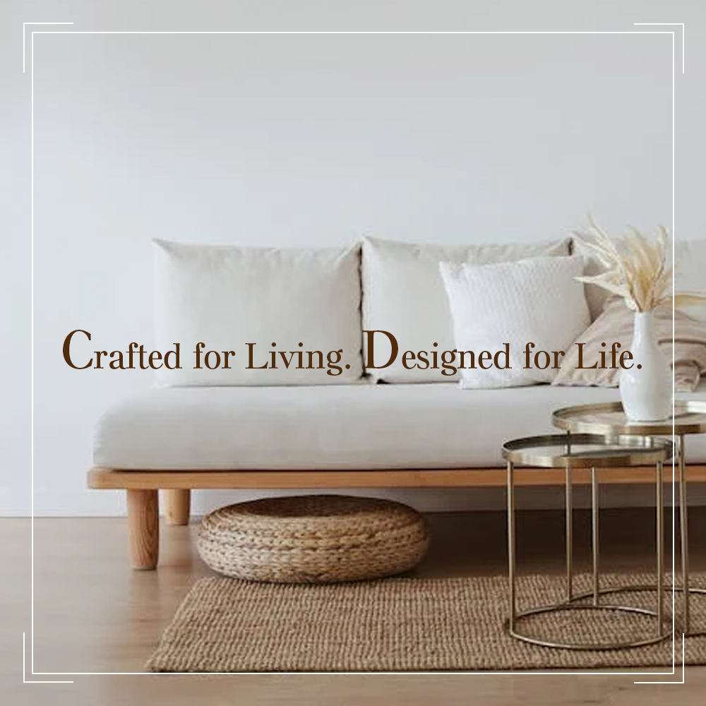 Sofa with decorative pillows and a coffee table in a minimalistic living room.